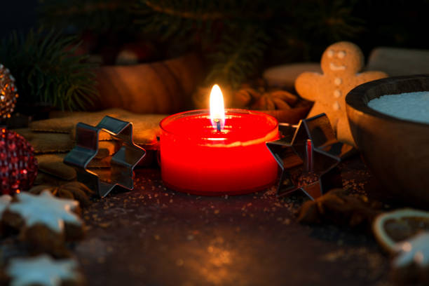 istock ingredients for Christmas baking and a burning candle 865836198