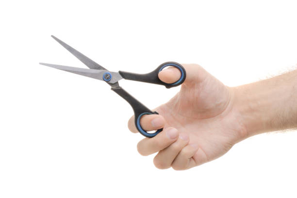 istock Scissors in a male hand 865836578