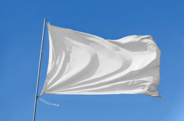 flag waving on the sky White flag attached to a flagpole waving on the sky symbols of peace photos stock pictures, royalty-free photos & images