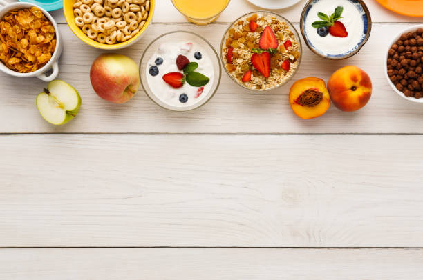 istock Healthy breakfast meals on wooden table copy space 865837404