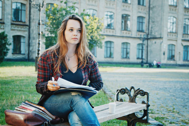 istock the student is sitting on the bench 865840426