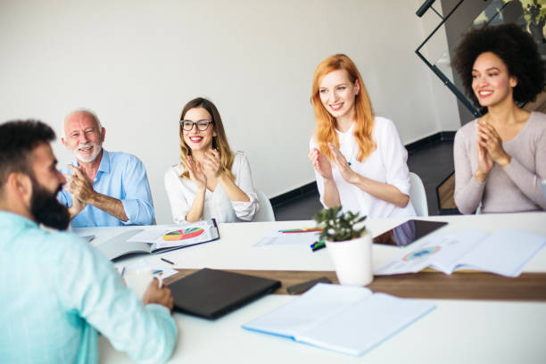 istock Group of business people applauding 865844884