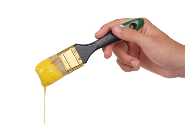 istock Yellow paint and brush 865848328