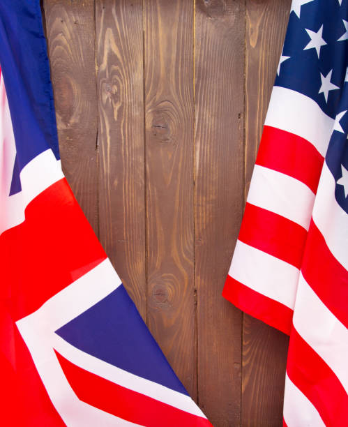 istock USA flag and UK Flag background. 865848540