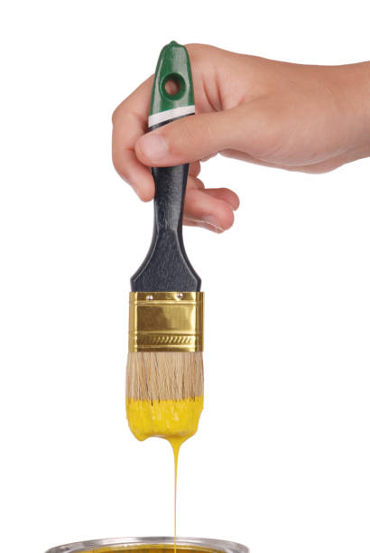 istock Yellow paint and brush 865848904