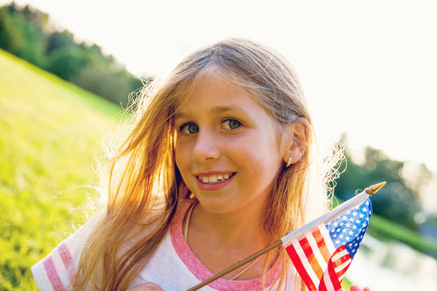 istock American Girl with a Flag 865854532