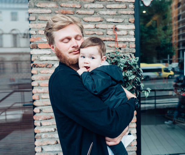 istock Dad with a small son in his arms 865854974