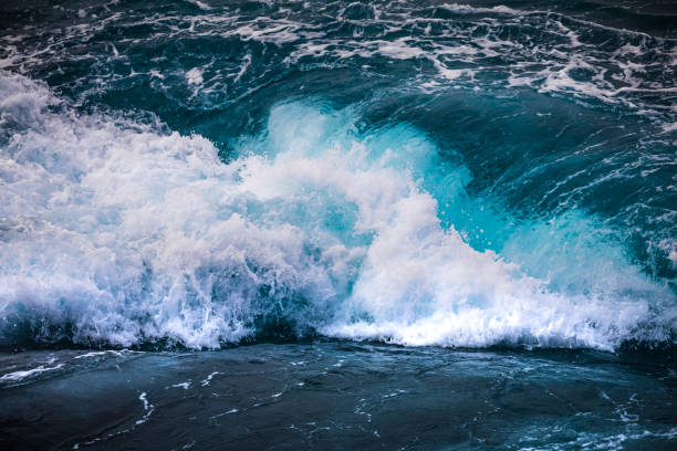 istock vertiginous, swirling foamy water waves 865855658