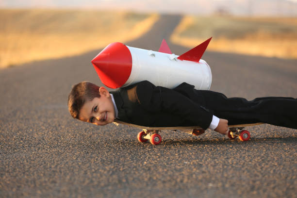 istock Child businessman ready to fly on skateboard 865860070