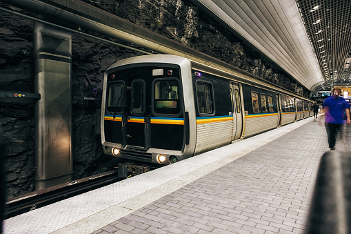 photo of subway arriving at underground station