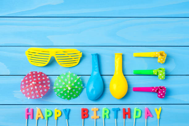 istock Birthday accessories on blue wooden background 865860588