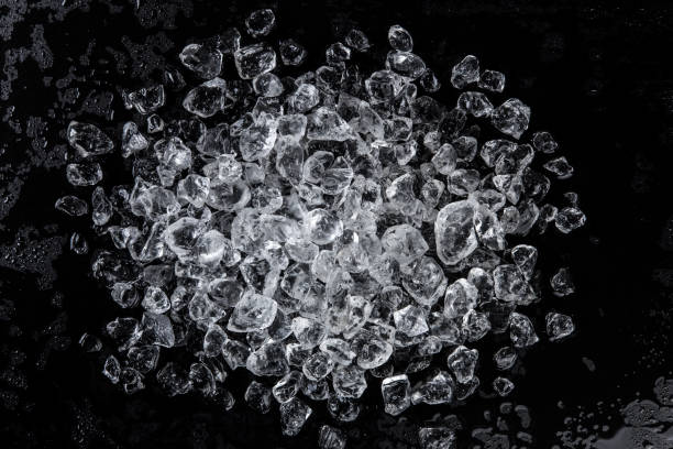 istock Pile of crushed ice on a black table. Top view 865863992