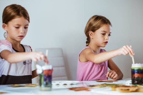 istock Two little girls enjoying paint 865864684