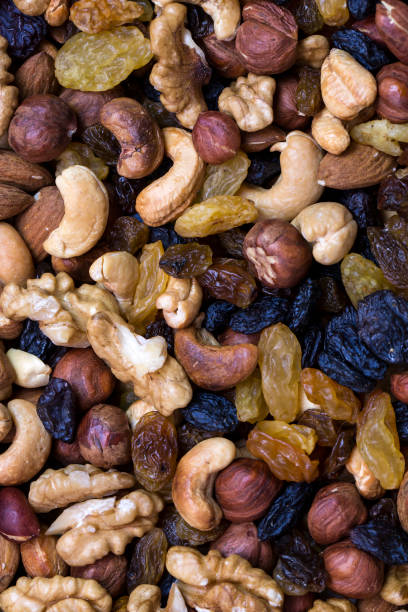 istock Background mix of nuts and raisins 865864834