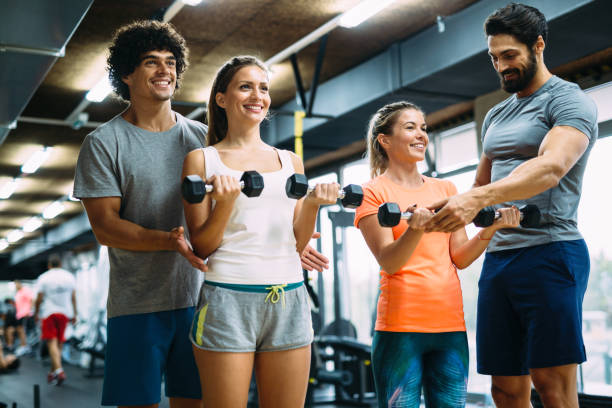 istock Young beautiful women doing exercises with personal trainers 865867890