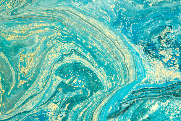 istock Modern artwork with abstract marble painting.   Mixed blue and yellow paints. Unusual handmade background for poster, card, invitation. Acrylic paints on water surface. Horizontal. 865867976