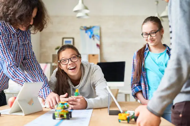 Photo of Excited pupils enjoying robotic games