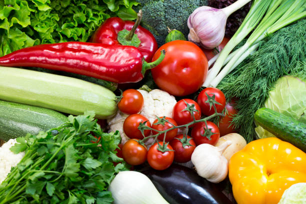 istock background of fresh vegetables and greens 865868410