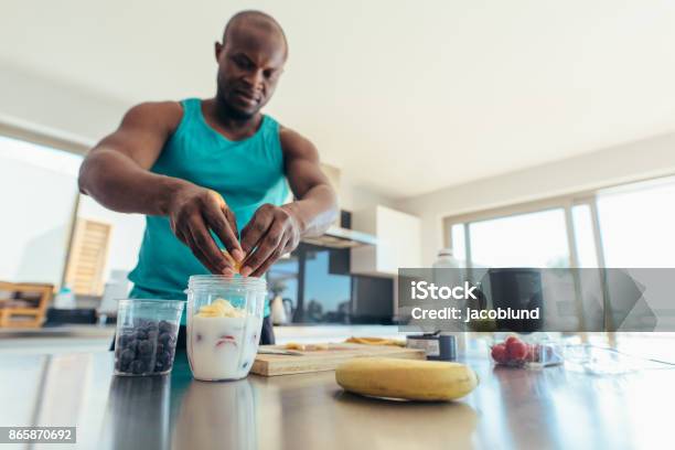 Man Preparing Breakfast In Kitchen Stock Photo - Download Image Now - Exercising, Healthy Lifestyle, Healthy Eating