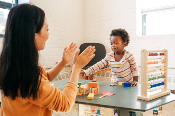 istock Parent playing with toddler 865872194