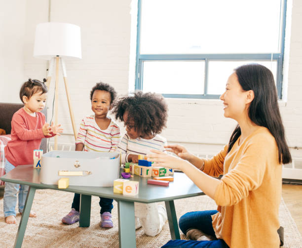 istock Parent playing with toddlers 865872218