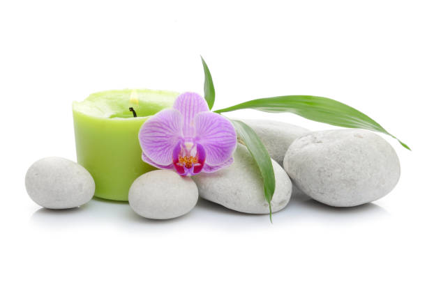 istock Bamboo, candle, Spa stones on white background 865881472