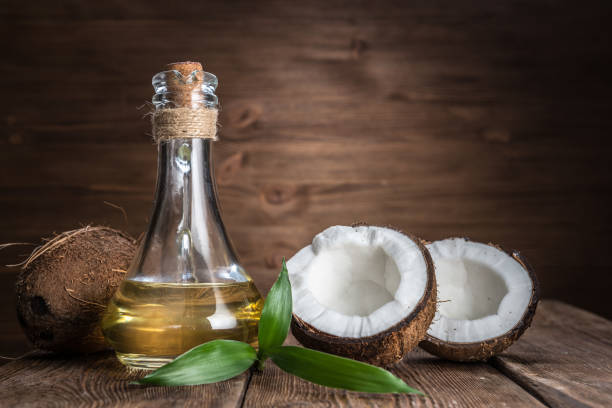 Spa still life with coconut and massage oil Spa still life with coconut and massage oil cocos stock pictures, royalty-free photos & images