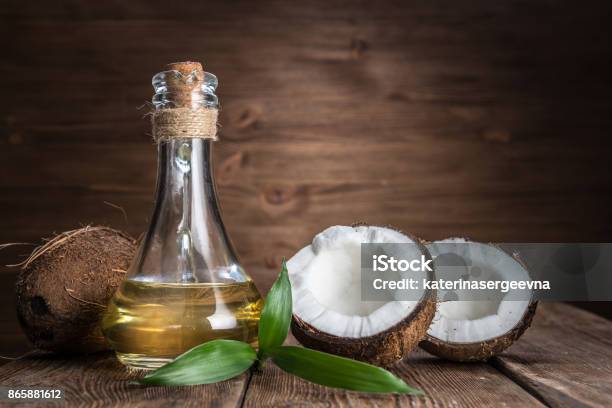 Spa Still Life With Coconut And Massage Oil Stock Photo - Download Image Now - Coconut Oil, Coconut, Coconut Palm Tree