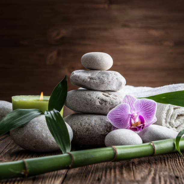 istock Stones hot stone, Orchid, bamboo and candle. Zen relaxation 865883678