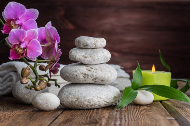istock Stones hot stone, Orchid, bamboo and candle. Zen relaxation 865883738