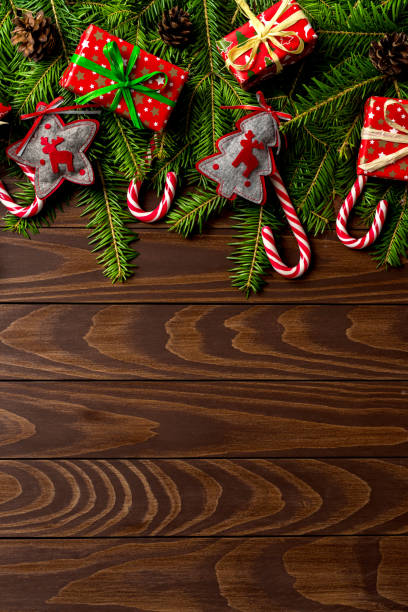 istock Christmas background with colorful gift boxes and decorations over wooden table 865883874