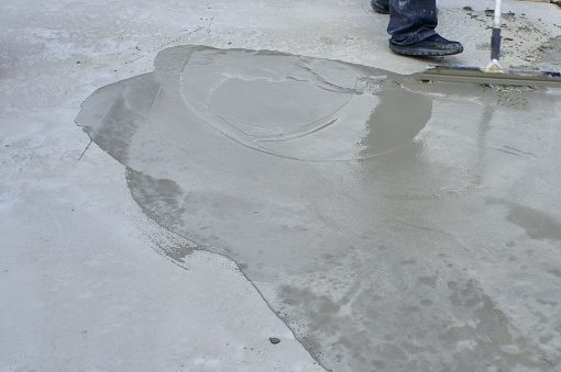 Wet Concrete Overlay with Worker