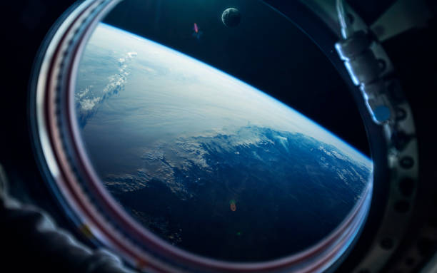 istock Science fiction space wallpaper, blue earth from space station window. Elements of this image furnished by NASA 865884850