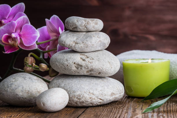 istock Stones hot stone, Orchid, bamboo and candle. Zen relaxation 865884978