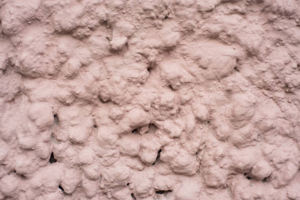 Background of the beige cement wall is plaster rough style.