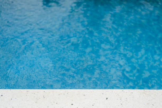 istock Swimming pool edge at the sunny day. Vacation background. Copy Space 865889640