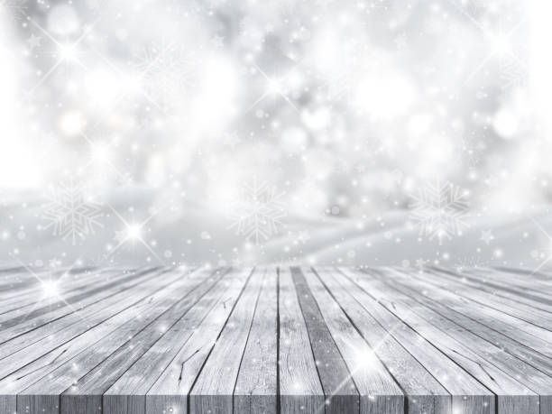 istock 3D wooden table against Christmas snowflake background 865892810