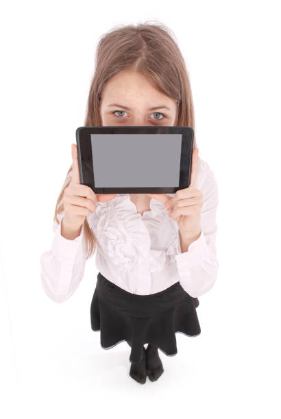 istock Beautiful young woman holding digital tablet 865893760