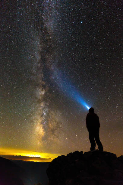 istock Silhouette of a man looking at stars 865899394