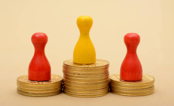 istock Winning Pawns concept on Golden Stack of Coins 865900004