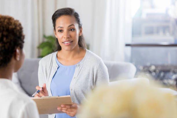 istock Psychologist counsels patient 865900212