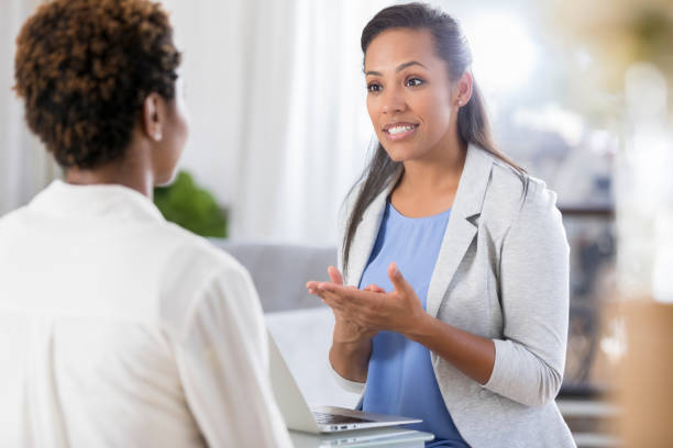 istock Caring counselor advises female client 865900222