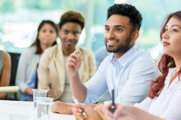 istock Attentive young businessman attends finance conference 865902980