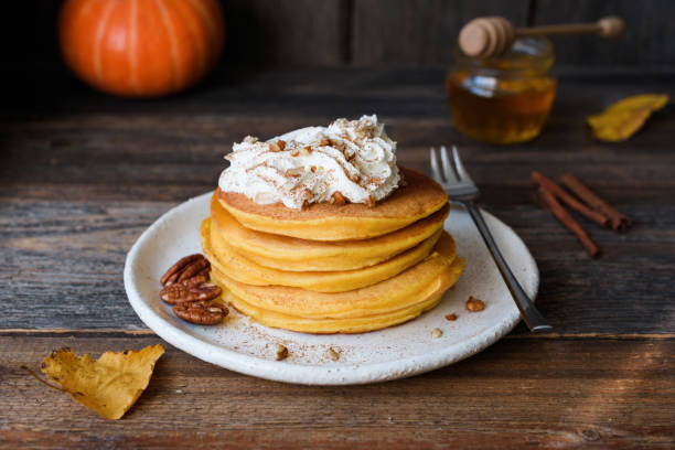 Pumpkin pancakes with whipped cream