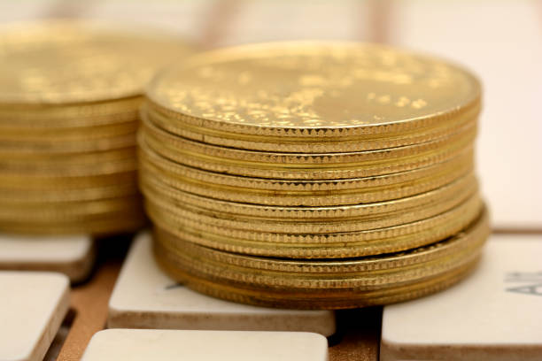istock Close up of Golded Coins on keyboard 865903420
