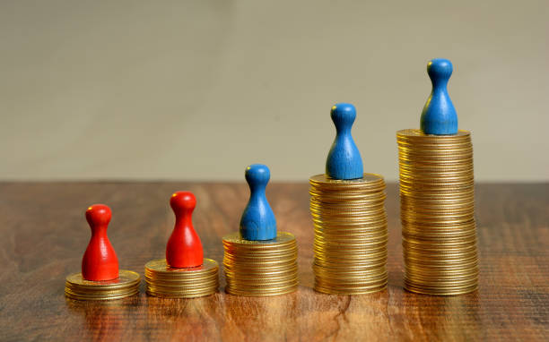 istock Stack of Golden Coins Graph going up with pawns 865903548