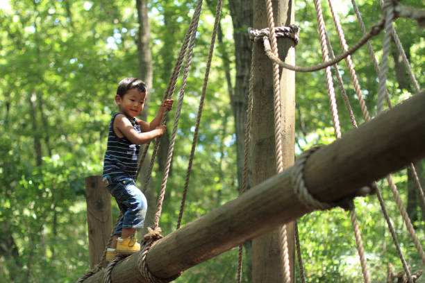istock Japanese boy playing at outdoor obstacle course (3 years old) 865905980