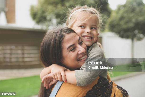 Little Girl In Moms Hug Stock Photo - Download Image Now - One Parent, Candid, Child