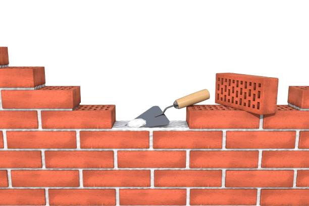 istock unfinished red brick wall with mortar, trowel on white background isolated. 865906696