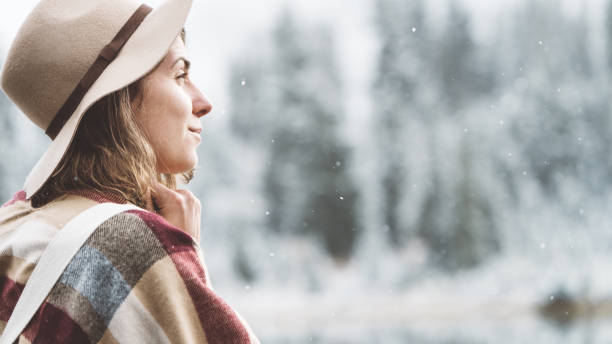istock Traveling woman enjoying frozen wilderness 865907036